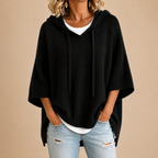 Saga | Stickad poncho med huva och trekvartsärm