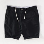 Strandshorts för herr i linne-bomull, sommarlook med knappstängning - Sandro